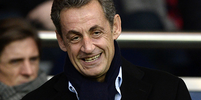 Former French president Nicolas Sarkozy reacts during the French L1 football match between Paris Saint-Germain and Nice on November 29, 2014 at the Parc des Princes stadium in Paris. AFP PHOTO / FRANCK FIFE
