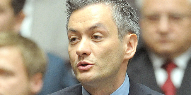 (FILES) This picture taken on November  8, 2011 shows the first openly gay Polish lawmaker, Robert Biedron, from Palikot's Movement during a session of the Polish Parliament in Warsaw. Polish voters have elected their first openly gay mayor as the heavily Catholic country gradually shifts its stance on gay rights after Biedron won a runoff municipal election on November 30, 2014 with 57 percent of the vote in the northern city of Slupsk.AFP PHOTO / JANEK SKARZYNSKI