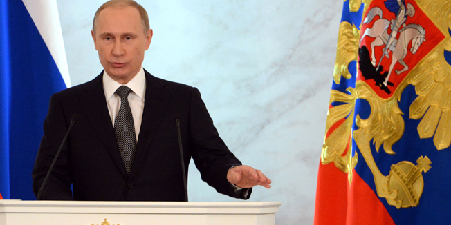 Russian President Vladimir Putin delivers a speech during his annual address to the Federal council (the two houses of the Russian parliament) in the Kremlin in Moscow on December 4, 2014.  AFP PHOTO / VASILY MAXIMOV
