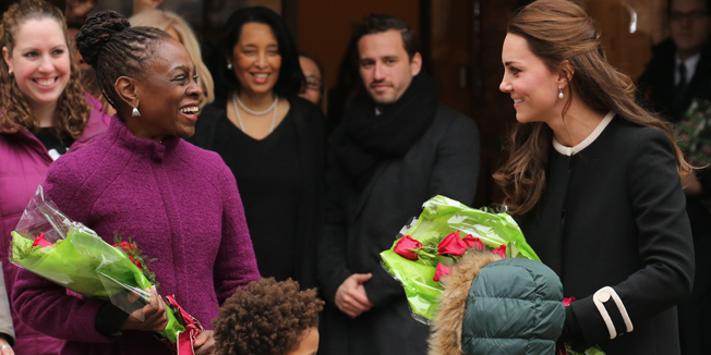 NEW YORK, NY - DECEMBER 08: Catherine, Duchess of Cambridge (R) and New York City Mayor Bill de Blasio's wife Chirlane McCray (L) greet guests at Northside Center for Child Development on December 8, 2014 in New York City. Prince William, Duke of Cambridge and Catherine, Duchess of Cambridge are on their official two-day visit to the United States.   Neilson Barnard/Getty Images/AFP== FOR NEWSPAPERS, INTERNET, TELCOS & TELEVISION USE ONLY ==