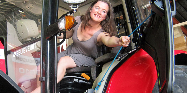 TO GO WITH AFP STORY BY LAWRENCE BARTLETT(FILES) -- A file picture taken on November 9, 2014 shows Manon Ossevoort of the Netherlands posing in her tractor at a workshop where mechanics are putting the finishing touches on her tractor, some 40 kms outside Malmesbury in the South African Western Cape. Dutch actress and adventurer Manon 