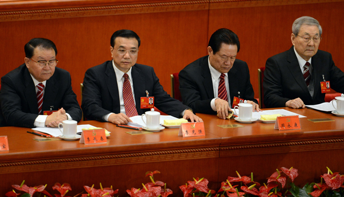 (FILES) In this file photo taken on November 8, 2012, Chinese leaders (L-R) Li Changchun, Vice Premier Li Keqiang, security chief Zhou Yongkang and former premier Zhu Rongji attend the opening of the 18th Communist Party Congress at the Great Hall of the People in Beijing. China's powerful former security chief Zhou Yongkang has been expelled from the Communist Party and arrested, state media reported on December 5, 2014. AFP PHOTO/GOH CHAI HIN