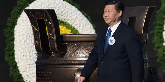 Chinese President Xi Jinping attends a memorial ceremony at the Memorial Hall of the Victims in Nanjing Massacre by Japanese Invaders on China's first National Memorial Day for Nanjing Massacre Victims in Nanjing city, east China's Jiangsu province on December 13, 2014.   A series of ceremonies was held to remember those killed when imperial troops raped and pillaged the then-capital of Nanjing in 1937.   AFP PHOTO / JOHANNES EISELE