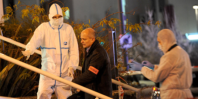 Forensic police collect evidence outside the police station of Joue les-Tours on December 20, 2014 where French police shot dead a man who attacked them with a knife in a police station while shouting 
