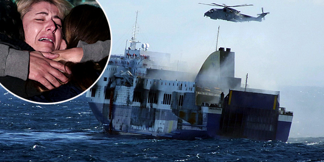A photo grab taken from a video made available by the Marina Militare Italiana on December 29, 2014, shows the ongoing rescuing operation of passengers by helicopter from the burned ferry 