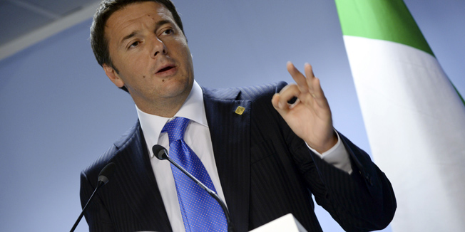 Italy's Prime Minister Matteo Renzi talks to the media at the end of an EU Summit held at the EU Council building in Brussels, on June 27, 2014.  EU leaders agreed to meet for an extraordinary summit on July 16 to decide how to fill key posts, the European Union said on June 27.AFP PHOTO/THIERRY CHARLIER