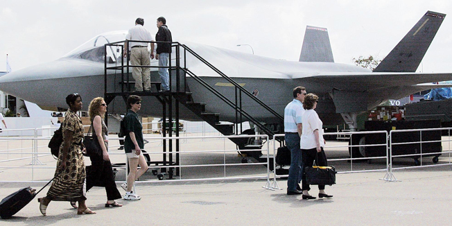 (FILES): This February 24, 2002 file photo shows the US F-35 jet fighter on display in front of the exhibition hall for the 11th Asian Aerospace exhibition in Singapore. The United States military is grounding its entire fleet of F-35 fighter jets as it completes additional engine inspections following a fire aboard an aircraft in Florida last week.    The US Air Force and Navy issued directives July 3, 2014 to halt all F-35 flights after the June 23 fire at Eglin Air Force Base. The cause of the incident remains unclear and is under investigation.    AFP PHOTO / Roslan RAHMAN / FILES
