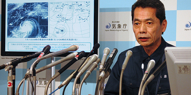 Satoshi Ebihara, Japan's meteorological agency expert, speaks at a press conference about a super typhoon at the agency in Tokyo on July 7, 2014. Super typhoon Neoguri was barrelling toward Japan's southernmost Okinawa islands, packing violent winds and torrential rains as officials warned residents to stay indoors, while the biggest US Air Force base in the Pacific evacuated some of its aircraft.  AFP PHOTO / JIJI PRES     JAPAN OUT