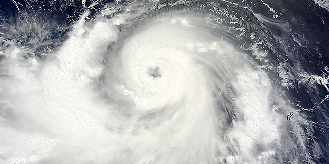 The MODIS instrument aboard NASA's Terra satellite captured this visible image of Typhoon Neoguri on July 5, 2014 at 01:20 UTC (July 4 at 9:20 p.m. EDT) as it moved through the Northwestern Pacific Ocean. Japan was bracing July 8, 2014 for one of its worst storms in over a decade as typhoon Neoguri barreled towards the southern Okinawa island chain, with 55,000 people urged to evacuate as the weather agency issued its highest alert.  The top-level warning means a threat to life, as well as the risk of massive damage from torrential rains and gusts of up to 250 kilometres (155 miles) per hour.   AFP PHOTO / NASA Goddard MODIS Rapid Response Team          == RESTRICTED TO EDITORIAL  USE / MANDATORY CREDIT:  