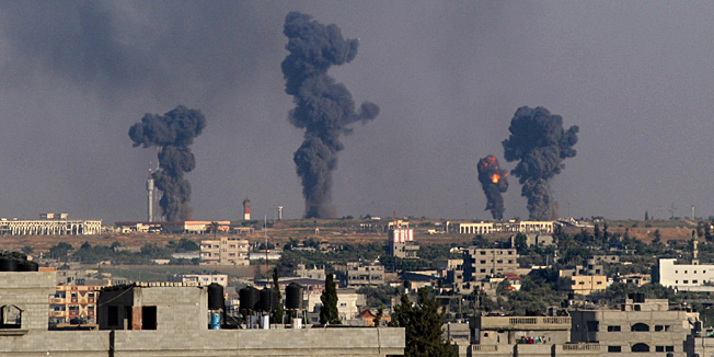 TOPSHOTSA ball of fire is seen following an Israel airstrike on Gaza International Airport in Rafah, southern Gaza, on July 7, 2014. Israeli air strikes on Gaza killed eight Palestinian militants, medics said after recovering several bodies from a collapsed tunnel in Rafah. AFP PHOTO / SAID KHATIB
