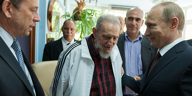 Handout picture released by Cuban official website www.cubadebate.cu showing former Cuban President Fidel Castro (C) talking with Russian President Vladimir Putin (R) on July 11, 2014 in Havana.  Putin visited Russia's Cold War ally Cuba on Friday, launching a tour that will see him cozy up to Latin America amid newly frayed relations with the West. AFP PHOTO/Alex Castro/HO/www.cubadebate.cu      RESTRICTED TO EDITORIAL USE - MANDATORY CREDIT 