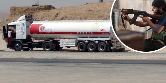 Oil tankers transport petrol sold by IS (Islamic State) to Kurdish business men on July 12, 2014, in Iraq's disputed northern city of Kirkuk. Iraq's Kurdish region claimed disputed northern oilfields in another blow to efforts to forge a united front against a jihadist-led onslaught, as twin bombings killed 28 people. AFP PHOTO/MARWAN IBRAHIM