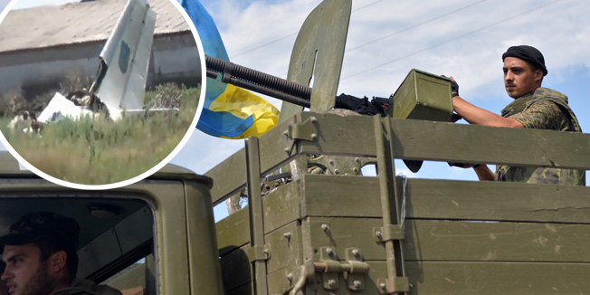 A Ukrainian serviceman rides on a truck in the small eastern city of Seversk on July 12, 2014, a day after the city was freed from pro-Russian militants. Ukraine's leader Petro Poroshenko has accepted an invitation to attend Sunday's World Cup final in Rio de Janeiro, with Russian President Vladimir Putin there too, amid a crisis between their countries, Brazil's government said. AFP PHOTO/ GENYA SAVILOV