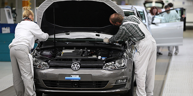 WOLFSBURG, GERMANY - FEBRUARY 25:  Volkswagen employees do a final check on a new VW Golf VII car at the Volkswagen factory on February 25, 2013 in Wolfsburg, Germany. Volkswagen will announce financial results for 2012 on March 14.  (Photo by Sean Gallup/Getty Images)