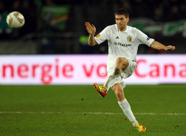 HANOVER, GERMANY - DECEMBER 15: Yevhen Peskov of Poltava runs with the ball during the UEFA Europa League Group B match between Hannover 96 and FC Vorskla Poltava at AWD Arena December 15, 2011 in Hanover, Germany.  (Photo by Martin Rose/Bongarts/Getty Images) 