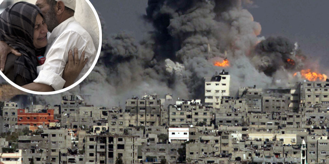 TOPSHOTSHeavy smoke and fire billow following an Israeli military strike in Gaza City on July 29, 2014. The Israeli offensive, which began on July 8 to end Hamas rocket attacks on the Jewish state, has killed more than 1,100 Palestinians, mostly civilians according to the United Nations, while 56 lives have been lost on the Israeli side, all but three of them soldiers. AFP PHOTO / ASHRAF AMRA