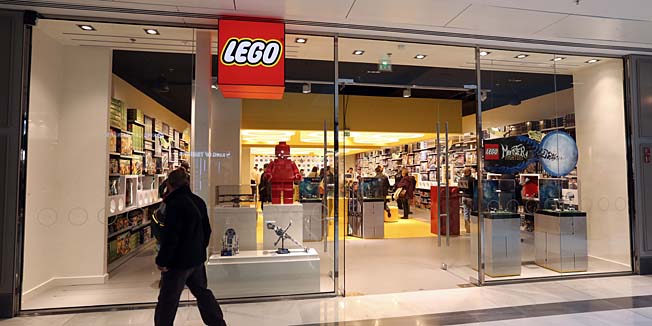 A man passes by the newly-opened store of Danish construction toys group Lego on October 18, 2012 at the 