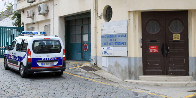 A police car arrives at the premises of the judicial police in Perpignan, southwestern France, on August 2, 2014. A French narcotics police officer was arrested on August 2, on the Spanish border, where he was on vacation, on suspicion of stealing over 50 kilos of seized cocaine from the Paris police headquarters. The 34-year-old officer, who was not publicly identified, was believed to have made off with the illegal drugs -- which have a street value of up to three million euros ($4 million) -- after security cameras spotted a person resembling him entering the headquarters with two bags, according to a joint statement from police and prosecutors.  AFP PHOTO / RAYMOND ROIG