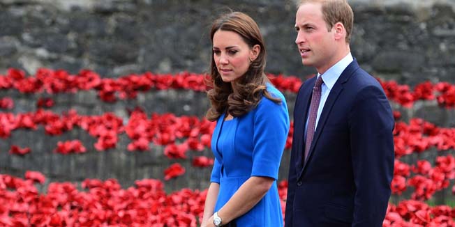 Britain's Catherine, Duchess of Cambridge (L), her husband Prince William, Duke of Cambridge, (2nd L) and Prince Harry (R) are pictured during a visit to the Tower of London's 'Blood Swept Lands and Seas of Red' poppy installation, in central London, on August 5, 2014. The installation will eventually consist of 800,000 ceramic poppies planted in the dry moat over the summer to create a major art installation. In total, 888,246 ceramic poppies will be planted in the moat, one for each British and Colonial fatality during WWI. AFP PHOTO / CARL COURT