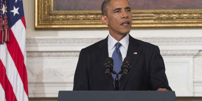 US President Barack Obama speaks about the situation in Iraq in the State Dining Room at the White House in Washington, DC, August 7, 2014. Obama said he authorized air strikes and relief supply drops in Iraq to prevent 