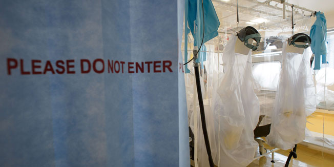 Protective clothing and facilities are in place at the Royal Free Hospital in north London on August 6, 2014, in preparation for a patient testing positive for the Ebola virus. The specialised unit allows a team of doctors and nurses to provide care for anyone with the contagious condition. Despite it's high mortality level, Consultant Stephen Mepham advised against panic, stating that the chances of meeting an undiagnosed patient are virtually impossible with next to no chance of catching the virus without exposure to the sufferer's bodily fluids. AFP PHOTO/Leon Neal