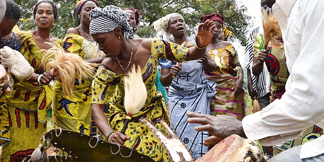 Women of Kandopleu village dance during a welcoming ceremony for Ivory Coast's Health minister, visiting to present the prophylactic mesures against Ebola fever, on August 14, 2014 near Biankouma near the border with Guinea and Liberia. Ivory Coast announced on August 11, 2014 that it has banned all flights from countries hit by Ebola as part of steps to prevent the deadly virus from reaching the west African nation. AFP PHOTO / ISSOUF SANOGO