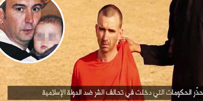 An image grab taken from a video released by the Islamic State (IS) and identified by private terrorism monitor SITE Intelligence Group on September 2, 2014 purportedly shows footage of a masked militant in a desert landscape threatening to kill British David Cawthorne Haines.  The so-called 