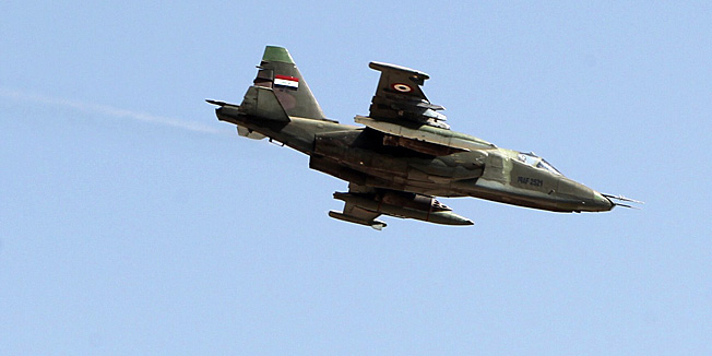 An Iraqi Sukhoi Su-25 jet flies over the town of Amerli on September 3, 2014. Amerli was besieged when Islamic State-led militants launched a major offensive in June, overrunning chunks of five Iraqi provinces and sweeping security forces aside, though security forces have now begun to claw back some ground. AFP PHOTO/ AHMAD AL-RUBAYE