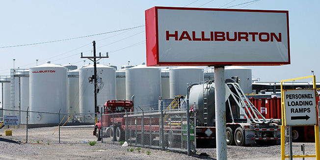 (FILES)In this April 8, 2011 file photo a Halliburton facility in Port Fourchon, Louisiana is seen.  Oil services company Halliburton agreed September 2, 2014 it would pay a $1.1 billion settlement over its role in the 2010 Gulf of Mexico oil rig blowout that led to the United States' worst-ever oil spill. Halliburton said the money would be paid to go the Gulf fishing industry and other victims of the Deepwater Horizon disaster, including some claims made in suits against oil giant BP.   AFP PHOTO / Mira OBERMAN / FILES