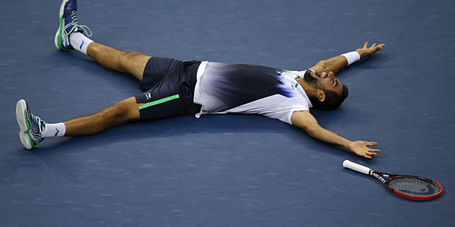 TOPSHOTSMarin Cilic of Croatia celebrates victory over Kei Nishikori of Japan in their US Open 2014 men's singles finals match at the USTA Billie Jean King National Center September 8, 2014  in New York. AFP PHOTO/Kena Betancur