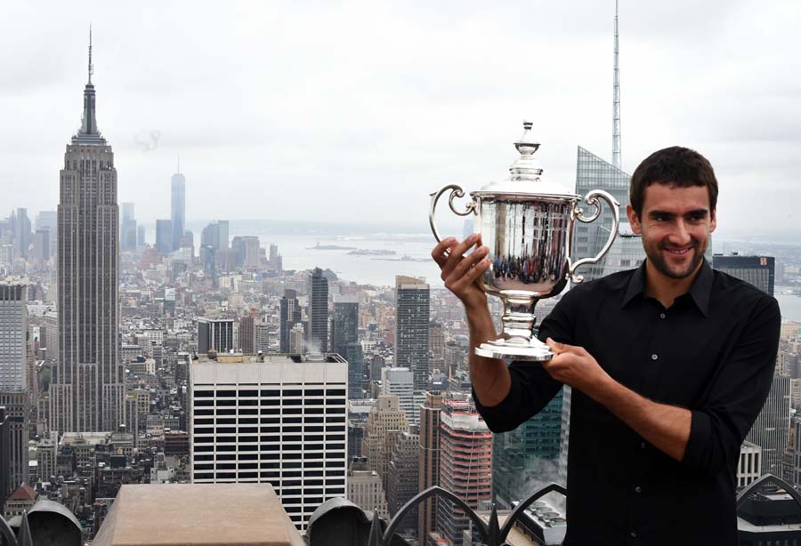 Marin Cilic  of Croatia, the 2014 US Open Men's Single champion, poses with his winning trophy at the Top of the Rock Observation Deck at Rockefeller Center in New York on September 9, 2014. Cilic hailed his maiden Grand Slam title at the US Open as a 