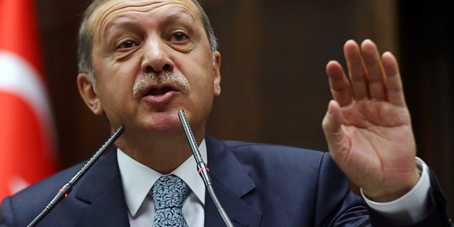 (FILES) This file picture dated on February 25, 2014 shows Turkey's Prime Minister Recep Tayyip Erdogan addressing members of his ruling AK Party (AKP) during a session at the Turkish parliament in Ankara. - Turkey's combative prime minister warned on March 20, 2014 that he would eradicate Twitter in the wake of damaging allegations of corruption in his inner circle that have spread across social networks in recent weeks.  AFP PHOTO/ADEM ALTAN