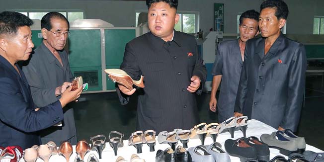 This undated photo released by North Korea's official Korean Central News Agency (KCNA) on July 26, 2014 shows North Korean leader Kim Jong-Un (2nd R) inspecting the Wonsan Shoe Factory in Kangwon Province.     THIS PICTURE WAS MADE AVAILABLE BY A THIRD PARTY. AFP CAN NOT INDEPENDENTLY VERIFY THE AUTHENTICITY, LOCATION, DATE, AND CONTENT  OF THIS IMAGE. THIS PHOTO IS DISTRIBUTED EXACTLY AS RECEIVED BY AFP.  AFP PHOTO / KCNA via KNS   REPUBLIC OF KOREA OUT   RESTRICTED TO EDITORIAL USE - MANDATORY CREDIT  