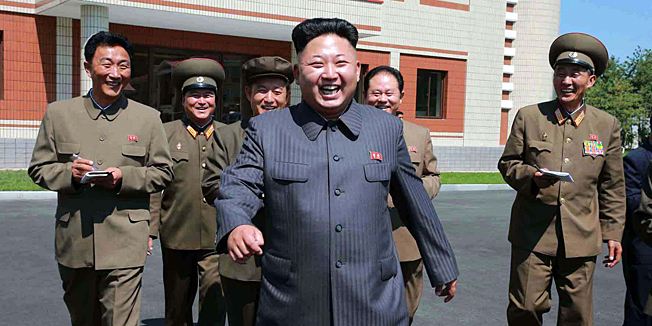This undated picture released from North Korea's official Korean Central News Agency (KCNA) on August 31, 2014 shows North Korean leader Kim Jong-Un (C) visiting the renewed October 8 factory.   AFP PHOTO / KCNA via KNS    REPUBLIC OF KOREA OUT ---EDITORS NOTE--- RESTRICTED TO EDITORIAL USE - MANDATORY CREDIT 