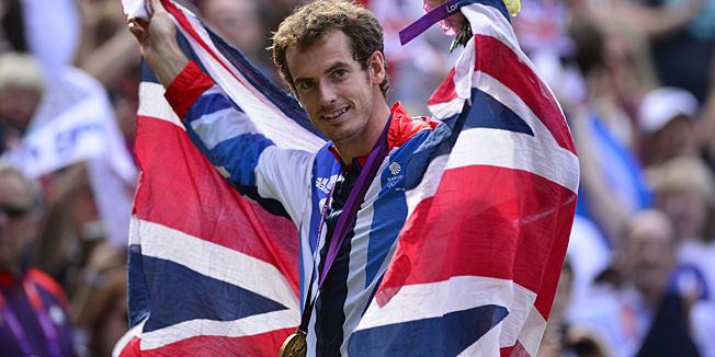 (FILES) - A picture dated August 5, 2012 shows Great Britain's Andy Murray holding the union flag as he poses with his gold medal at the end of the men's singles tennis tournament of the London 2012 Olympic Games, at the All England Tennis Club in Wimbledon, southwest London. Scottish tennis ace Andy Murray appeared on September 18, 2014 to lend his support to independence on polling day and condemned negative tactics by the 