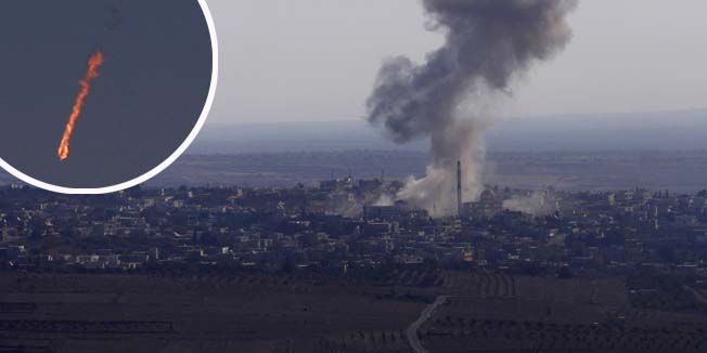 Smoke rises from the Syrian Syrian village of Jubata al-Khashab after it was bombed by a Syrian fighter jet on September 23, 2014, moments before the jet was shot down by the Israeli military over the Golan Heights. Israel shot down a Syrian fighter jet over the Golan Heights, the army said, indicating that it had crossed the ceasefire line into the Israeli-occupied sector. It was the most serious incident to take place on the strategic plateau since the outbreak of the Syrian civil war in 2011. AFP PHOTO/ JALAA MAREY