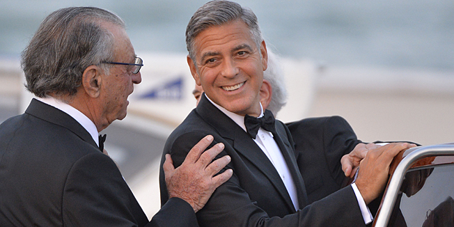 US actor George Clooney is pictured on a taxi boat after he leaves the Cipriani hotel on September 27, 2014 in Venice where Clooney and British fiancee, Amal Alamuddin celebrate their wedding. George Clooney has said goodbye to bachelorhood in Venice with a stag party at his favourite restaurant with Hollywood chums, and was gearing up for a day of glamourous pre-wedding celebrations. The actor had swept into the floating city yesterday with his British fiancee Amal Alamuddin on a watertaxi dubbed 