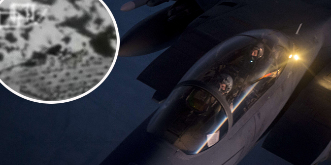This US Air Forces Central Command photo released by the Defense Video & Imagery Distribution System (DVIDS)  shows a US Air Force F-15E Strike Eagle receiving fuel from a KC-135 Stratotanker over northern Iraq after conducting airstrikes in Syria, September 23, 2014. These aircraft were part of a large coalition strike package that was the first to strike ISIL targets in Syria.  AFP PHOTO / US Air Force / Senior Airman Matthew Bruch (Released)     == RESTRICTED TO EDITORIAL USE / MANDATORY CREDIT: 