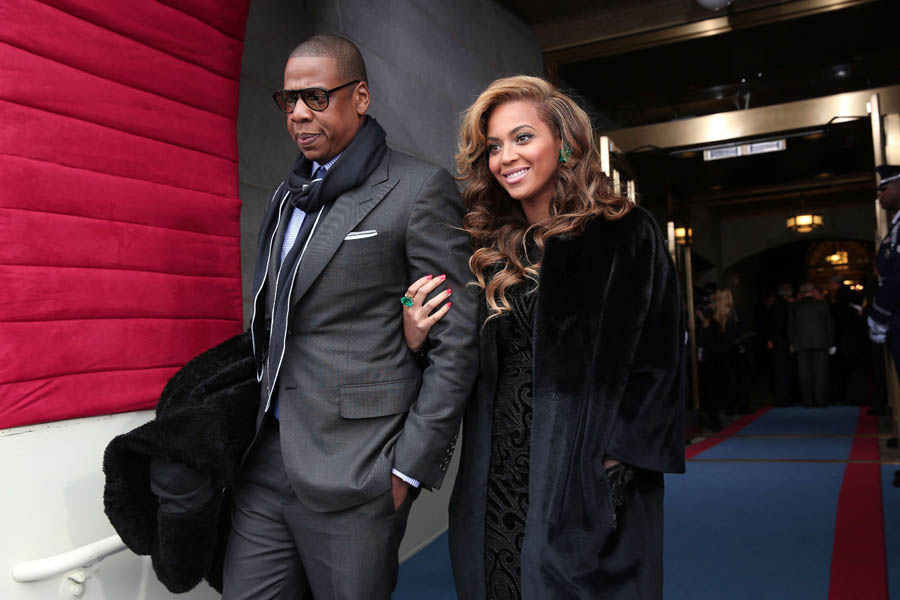Recording artists Jay-Z and Beyonce arrive at the presidential inauguration on the West Front of the US Capitol January 21, 2013 in Washington, DC.   Barack Obama was re-elected for a second term as President of the United States.    AFP PHOTO/POOL/WIN MCNAMEE
