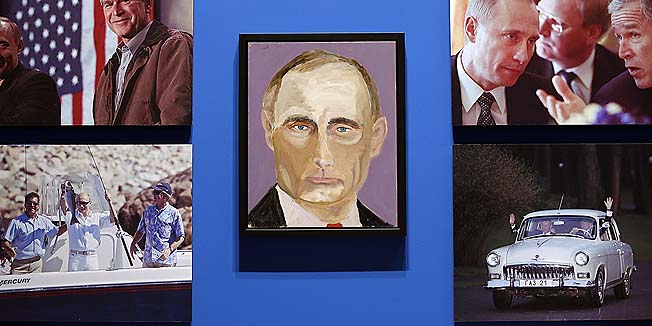 DALLAS, TX - APRIL 4: A portrait of Vladimir Putin, President of Russia painted by former president George W. Bush is displayed between photographs as part of the exhibit, 