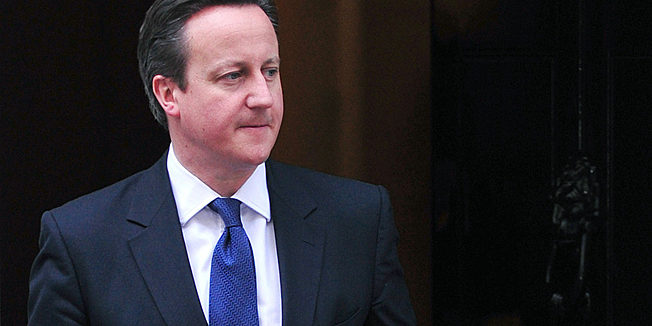 British Prime Minister David Cameron (L) prepares to welcome Irish President Michael Higgins at Downing Street in central London on April 9, 2014. Higgins arrived in London on April 8 in the first state visit by a president of the republic since it gained independence from neighbouring Britain. AFP PHOTO / CARL COURT