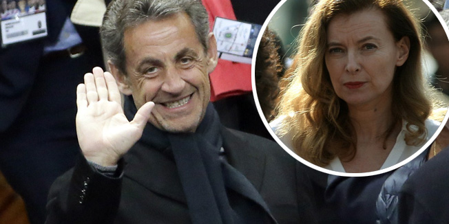 French former president Nicolas Sarkozy waves prior to attending the French League Cup final football match between Paris Saint-Germain (PSG) and Lyon (OL) on April 19, 2014 at the Stade de France in Saint-Denis, north of Paris. AFP PHOTO / KENZO TRIBOUILLARD