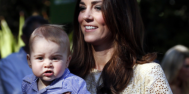 Catherine, the Duchess of Cambridge (R), carries her son Prince George as she and her husband, Britain's Prince William (not pictured), walk towards the enclosure for an Australian animal called a bilby, which was named after the young prince, during a visit to Sydney's Taronga Zoo on April 20, 2014. Britain's Prince William, his wife Kate and their son Prince George are on a three-week tour of New Zealand and Australia.    AFP PHOTO / POOL / David Gray