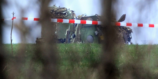This picture shows the wreckage of a Serbian Mi-17 type military helicopter that crashed near Belgrade airport on March 14, 2015. A Serbian military helicopter evacuating a five-day-old baby for emergency medical treatment has crashed in heavy fog, killing all seven people on board, the officials said on March 14. A four-member crew, two medical workers and the baby were all killed in the crash, Prime Minister Aleksandar Vucic said on public RTS television. AFP PHOTO / STR  ** SERBIA OUT **