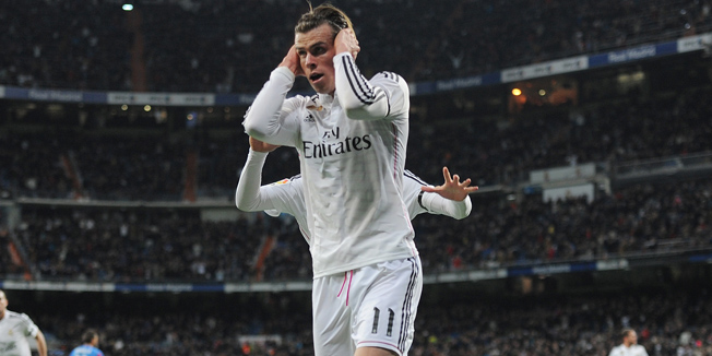 MADRID, SPAIN - MARCH 15:  Gareth Bale of Real Madrid celebrates after scoring Real's opening goal during the La Liga match between Real Madrid CF and Levante UD at Estadio Santiago Bernabeu on March 15, 2015 in Madrid, Spain.  (Photo by Denis Doyle/Getty Images)