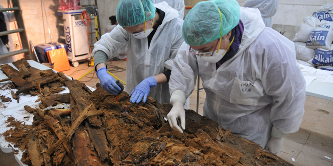 This handout picture released on January 26, 2014 by Sociedad de Ciencia Aranzadi shows people sifting through material discovered in a crypt that could help to confirm the final resting place of the autor of 