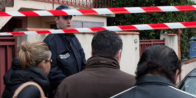 TOULOUSE, FRANCE - MARCH 19:  Police stand guard at the scene of a fatal shooting after a gunman opened fire outside the Ozar Hatorah school on March 19, 2012 in Toulouse, France. Four people, including three children, have been killed and others injured after a gunman opened fire outside a Jewish school as parents dropped their children off for morning classes.  (Photo by Gilles Bouquillon/Getty Images)