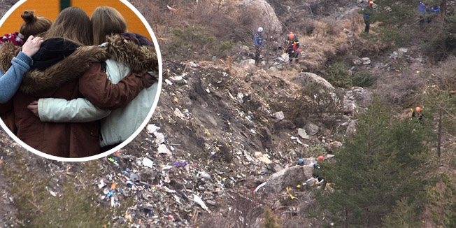 QUALITY REPEATA screengrab taken from an AFP TV video on March 24, 2015 shows search and rescue personnel near scattered debris while making their way through the crash site of the Germanwings Airbus A320 that crashed in the French Alps above the southeastern town of Seyne. The plane, which had taken off from Barcelona in Spain and was headed for Dusseldorf in Germany, crashed earlier in the day with 150 people onboard.  AFP PHOTO /DENIS BOIS /GRIPMEDIA / AFP TV
