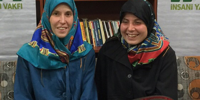 A handout picture taken March 27, 2015 and released on March 28, 2015 by the IHH (The Foundation for Human Rights and Freedom and Humanitarian Relief) shows two Czech women Antonie Chrastecka (L) and Hana Humpalova (R) posing after being rescued in Van, eastern Turkey, on March 27, 2015. Two young Czech women kidnapped in Pakistan in 2013 have been freed and have returned home, Prime Minister Bohuslav Sobotka said on March 28. He added that the two 26-year-old women were freed with the help of the Turkish Muslim humanitarian organisation IHH.  AFP PHOTO / IHHRESTRICTED TO EDITORIAL USE MANDATORY CREDIT 