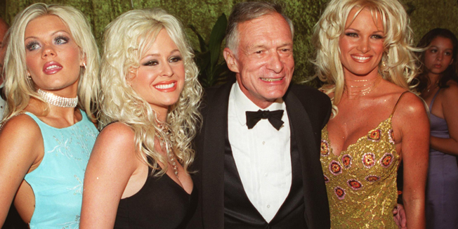 377857 12: Playboy's founder Hugh Hefner poses with a trio of blonde women at HBO's Emmy party at Spago's September 10, 2000 in Beverly Hills, CA. (Photo by Jason Kirk/Liaison)